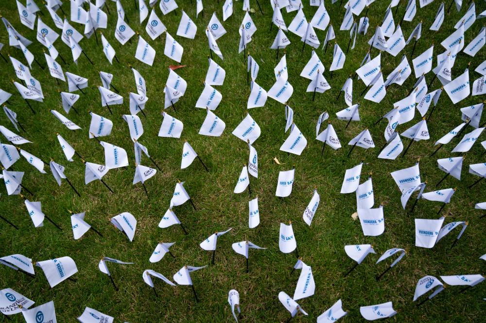 Founders Day flags in the grass on the Pew campus